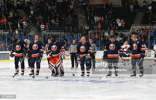 Brent Sopel, Alexei Zhitnik, Rick DiPietro, Jason Blake and Mark Parrish of the New York Islanders stand for the national anthem before the game...