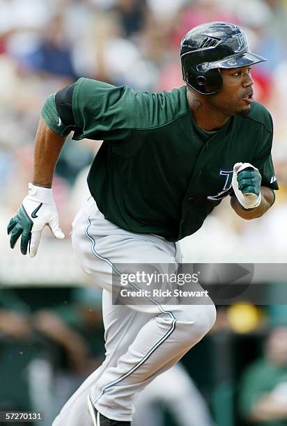 Carl Crawford of the Tampa Bay Devil Rays runs a base during the game against the Pittsburgh Pirates on March 12, 2006 at McKechnie Field in...