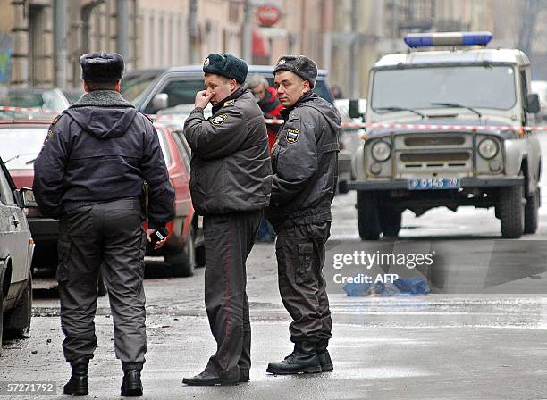 Russian police officers stand at the site, where a student from Senegal was killed, 07 April 2006, in Saint-Petersburg. A student from Senegal was...