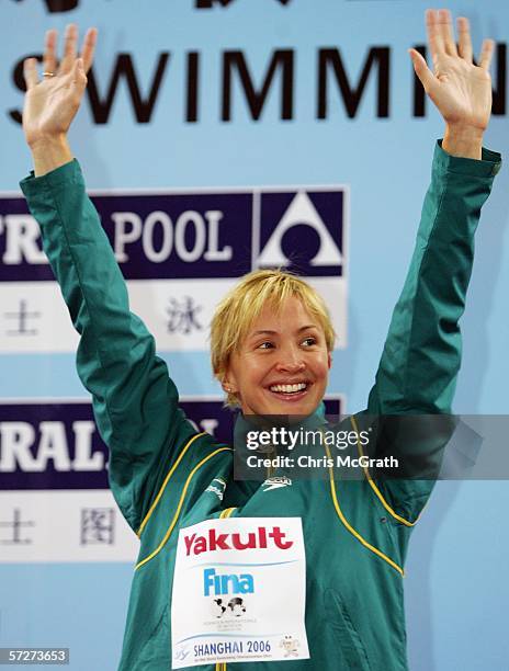 Brooke Hanson of Australia waves to the crowd after winning gold in the Women's 100m individual medley during day three of the FINA World Swimming...