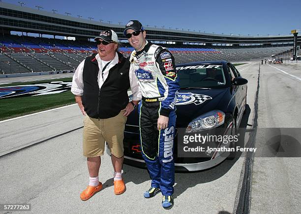 Chef Mario Batali poses with Jimmie Johnson dirver of the Lowe's Chevrolet during practice for the NASCAR Nextel Cup Series Samsung/RadioShack 500 at...