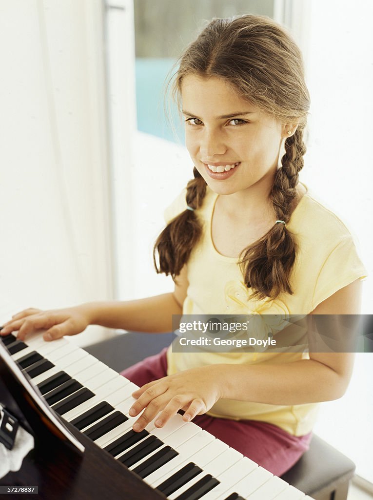 Portrait of a girl playing the piano