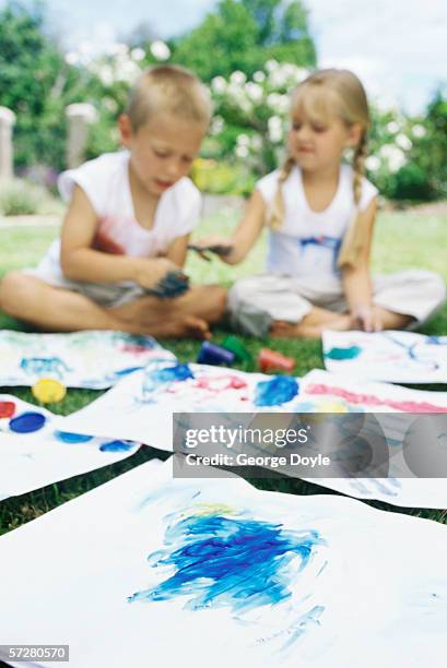 brother and his sister finger painting - 4 girls finger painting bildbanksfoton och bilder