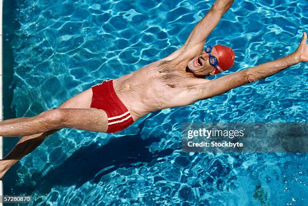 senior man swimming in the pool - old people diving stock pictures, royalty-free photos & images