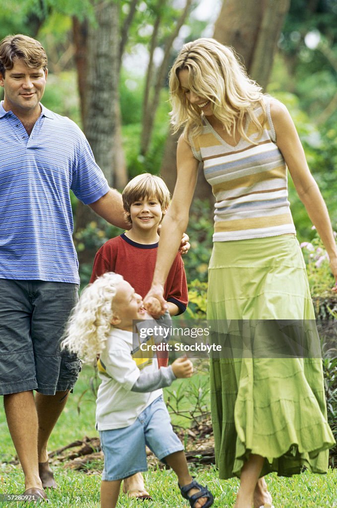 Parents with their son and daughter in a Park