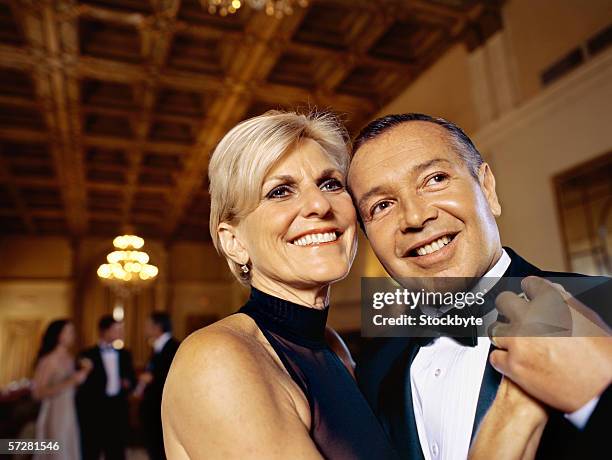 close up of a mature couple dancing - avondkledij stockfoto's en -beelden