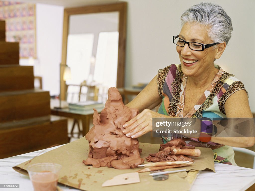 Close up of a senior woman sculpting