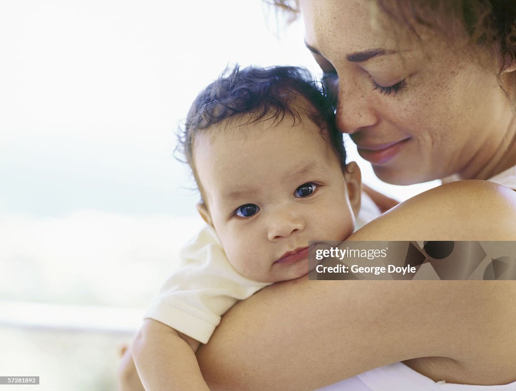 Close-up of a mother holding her baby boy