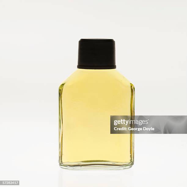 close-up of a bottle of cologne - aftershave stock pictures, royalty-free photos & images