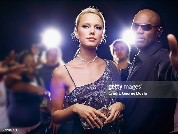 star and security guard at  ceremony award - evening wear stock pictures, royalty-free photos & images