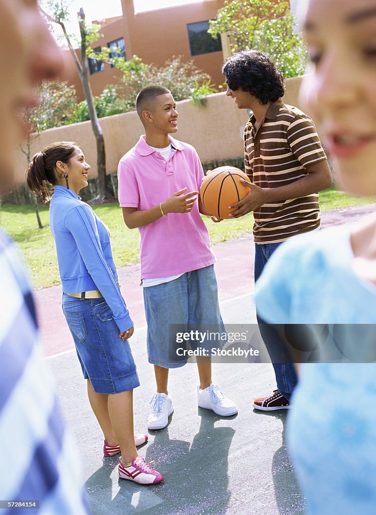 Teenagers standing and talking