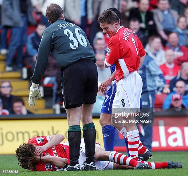 Charlton's Matt Holland and goalkeeper Thomas Myhre look at teammate Gonzalo Sorondo covering his face after an incident with Everton's James...