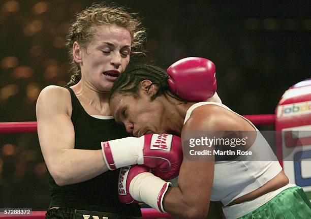 Ina Menzer of Germany and Maribel Santana of Domenican Republic seen in action during the WIBF World Championship Featherweight fight between Ina...