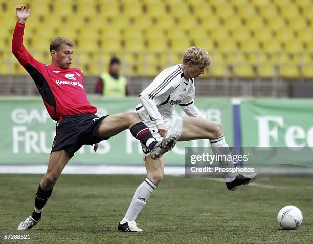 Vasily Berezutski of CSKA, Moscow competes against Pavel Pogrebnyak of Tom, Tomsk during the Russian League Championship match on April 08, 2006 in...