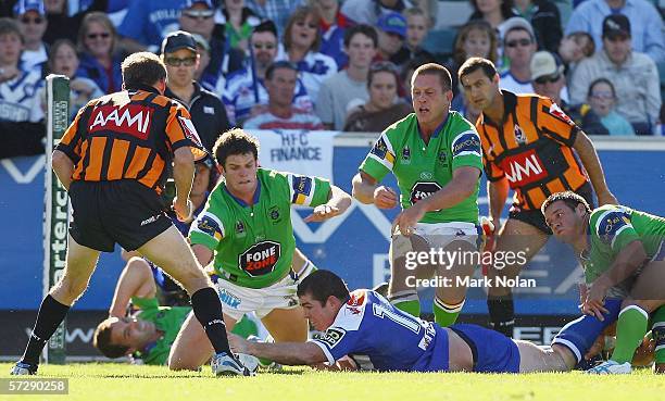 Andrew Ryan of the Bulldogs scores during the round five NRL match between the Canberra Raiders and the Bulldogs played at Canberra Stadium on April...