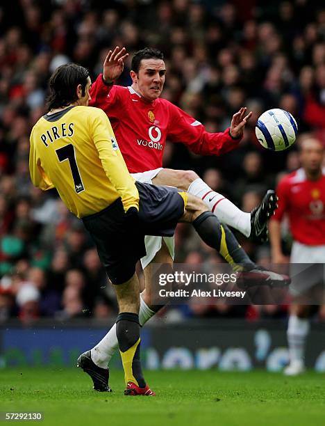 John O'Shea of Manchester United and Robert Pires of Arsenal battle for the ball during the Barclays Premiership match between Manchester United and...