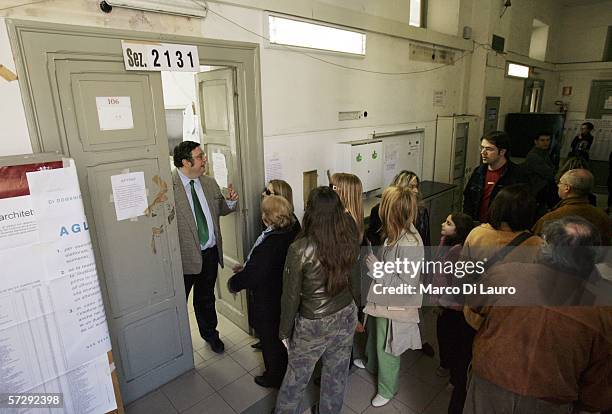 Italians wait in line to vote at a polling station April 9, 2006 in Rome, Italy. About 47 million Italians are eligible to vote on April 9 and April...