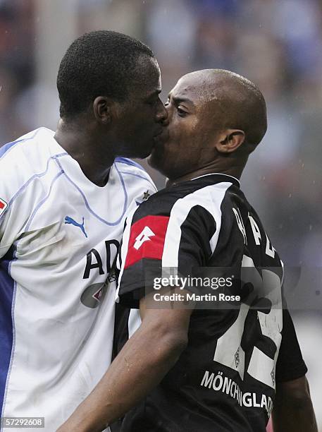 Thimothee Atouba of Hamburg and Nando Rafael of Gladbach square up to each other in a dispute during the Bundesliga match between Hamburger SV and...