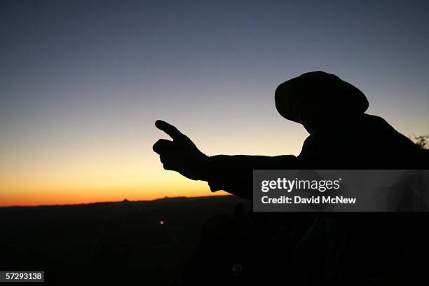 Minuteman Matt Sandt mans his nighttime post overlooking the U.S.-Mexico border as Minuteman Civil Defense Corps volunteers patrol the border in...