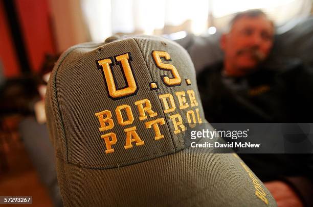 Minuteman George Royse rests his hat on his knee at the morning meeting as Minuteman Civil Defense Corps volunteers patrol the U.S.-Mexico border in...