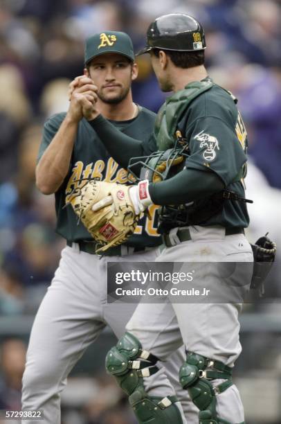 Relief pitcher Huston Street and catcher Jason Kendall of the Oakland Athletics celebrate after defeating the Seattle Mariners 6-4 on April 9, 2006...