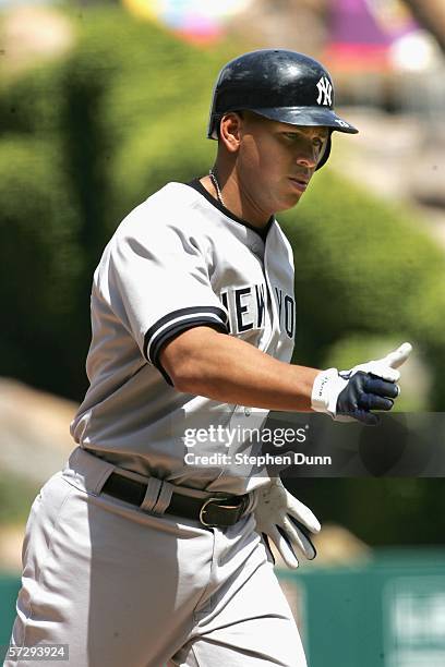 Alex Rodriguez of the New York Yankees gestures after hitting a home run in the second inning against the Los Angeles Angels of Anaheim on April 9,...