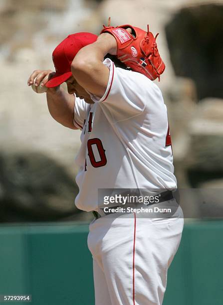 Bartolo Colon of the Los Angeles Angels of Anaheim adjusts his cap during the five run second inning by the New York Yankees on April 9, 2006 at...