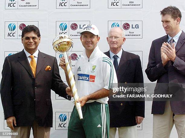 Narayanganj, BANGLADESH: Australian cricket team captain Ricky Ponting holds the LG International Cricket Council ranking trophy for the best test...