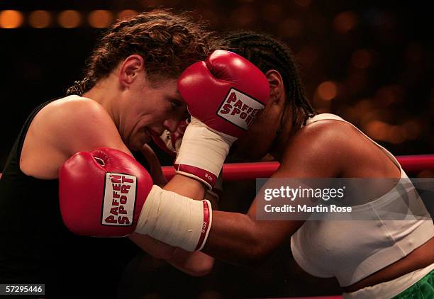 Ina Menzer of Germany and Maribel Santana of Dominican Republic seen in action during the WIBF World Championship Featherweight fight between Ina...