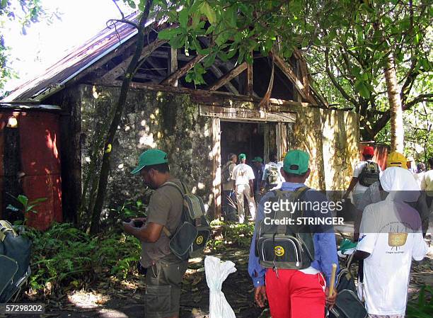 Peros Banos, MAURITIUS: Chagosians check their run-down church on Peros Banos Island 10 April 2006. Some 102 Chagosians who were evicted from the...