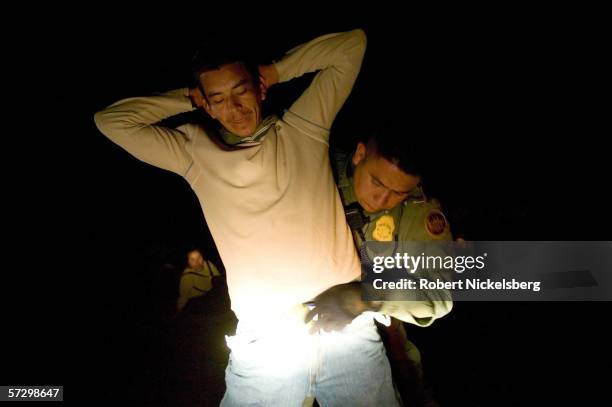 Armed agents from Customs and Border Patrol dropped from a helicopter for a night time interdiction operation intercept 8 Mexican nationals who...