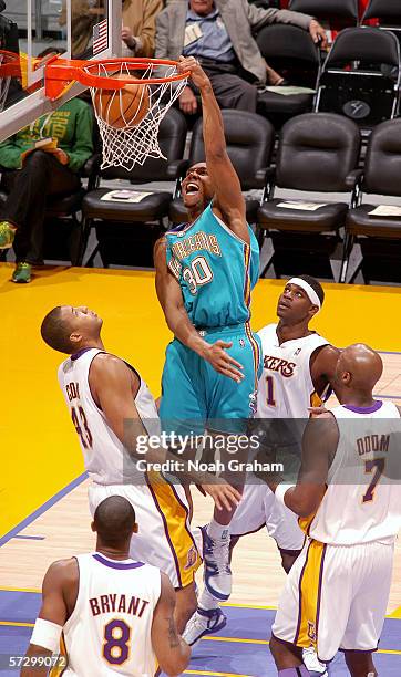 David West of the New Orleans/Oklahoma City Hornets dunks against the Los Angeles Lakers on March 26, 2006 at Staples Center in Los Angeles,...