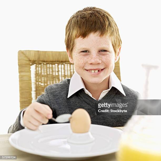 https://media.gettyimages.com/id/57299724/photo/portrait-of-a-young-boy-holding-a-spoon-sitting-in-front-of-a-plate-with-a-hard-boiled-egg.jpg?s=612x612&w=gi&k=20&c=Ou2MLYUFn01XDcq_XbGV1O8hjfWFyzehVgT7Y8Ojd-c=