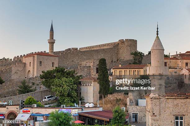 old castle of cesme and adjacent minaret, izmir - çeşme stock pictures, royalty-free photos & images