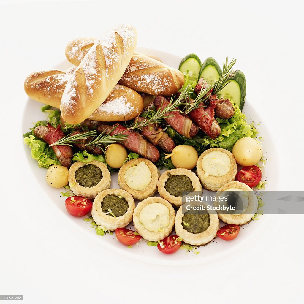 Dish of assorted vol-au-vents served with bread and bacon rolls