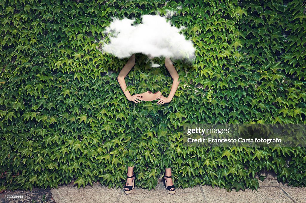 Image of young woman on ivy plants and cloud