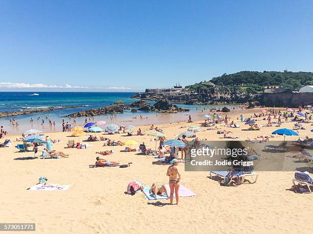 crowded beach on a hot summer day - spain stockfoto's en -beelden