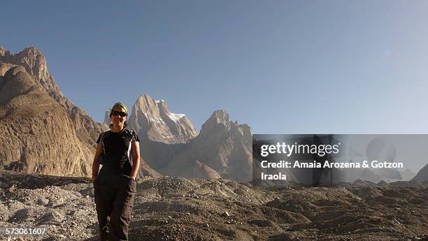 woman trekker in baltoro glacier and trango towers - trango towers stock pictures, royalty-free photos & images