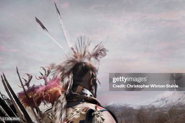 hunter wearing traditional native headdress - cherokee ethnicity stock pictures, royalty-free photos & images