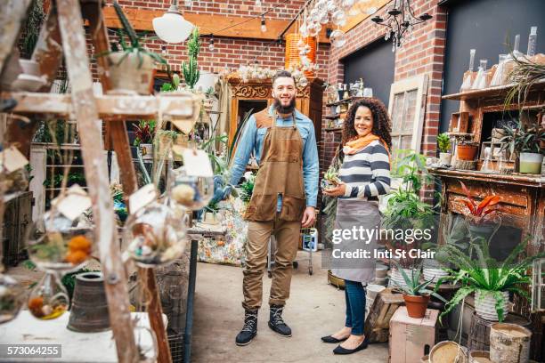 employees smiling in plant nursery - business mature couple portrait bildbanksfoton och bilder