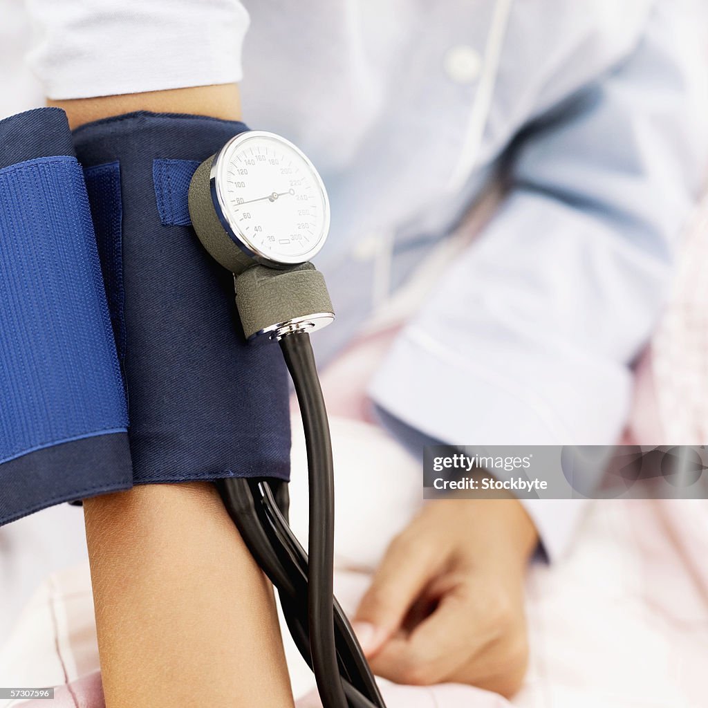 Blood pressure cuff on the arm of a patient