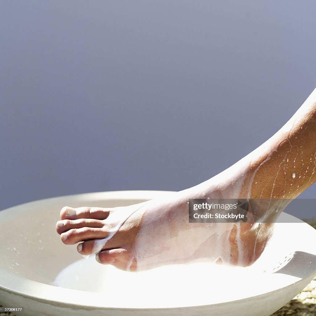Close-up of the foot of a young woman getting a pedicure