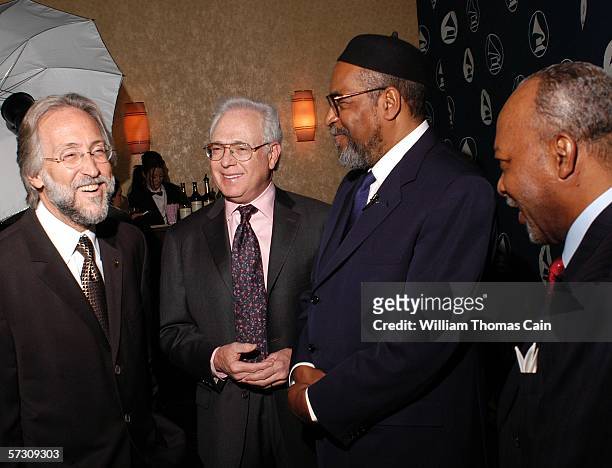 From left, Recording Academy President Neil Portnow chats with honorees Larry Magid, Kenny Gamble and Leon Huff pose backstage at the Recording...