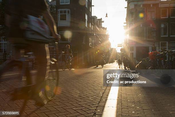 blurred view of bicyclist on city street - lower bildbanksfoton och bilder