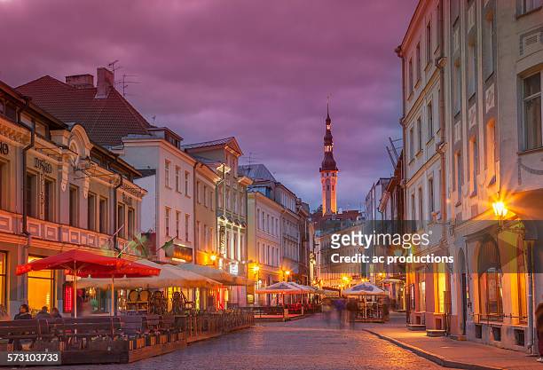 illuminated street in cityscape, tallin, estonia - tallinn stock pictures, royalty-free photos & images
