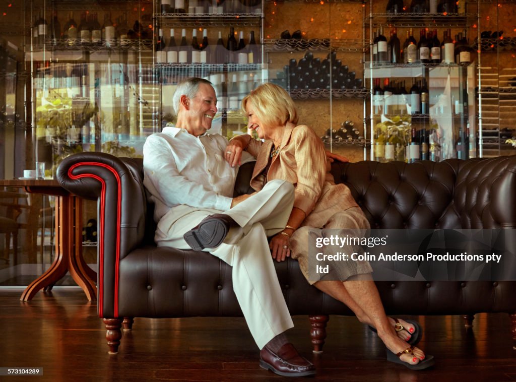Older Caucasian couple relaxing in lounge