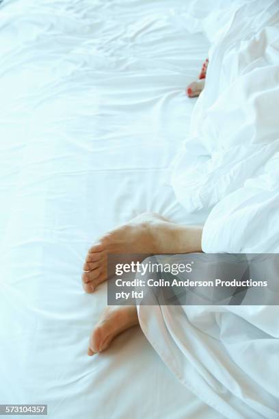 older caucasian couple sleeping on hotel room bed - low section bildbanksfoton och bilder