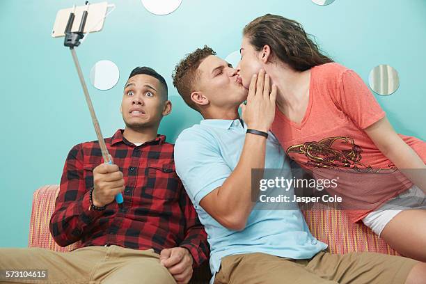 smiling friends taking selfie together - awkward selfie stock pictures, royalty-free photos & images