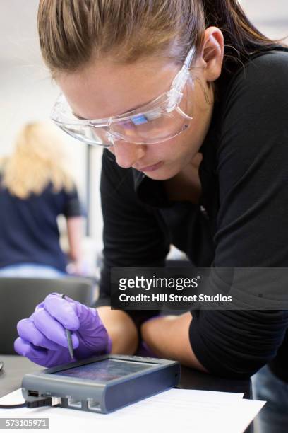 student using technology in science lab - lab closeups stock-fotos und bilder