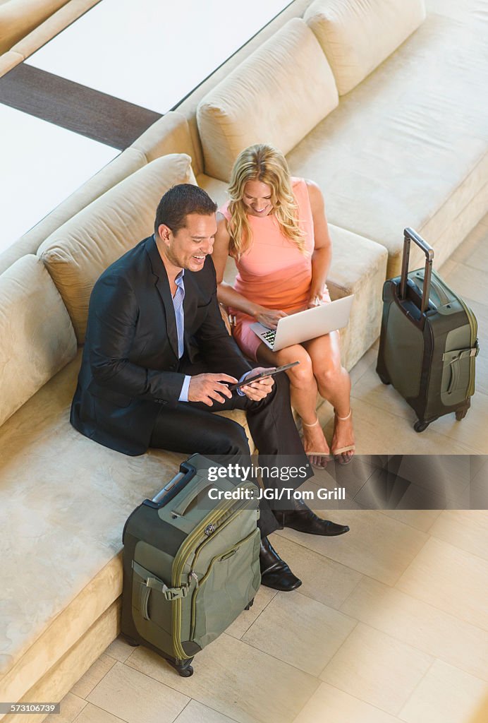 Overhead view of business people talking in lobby